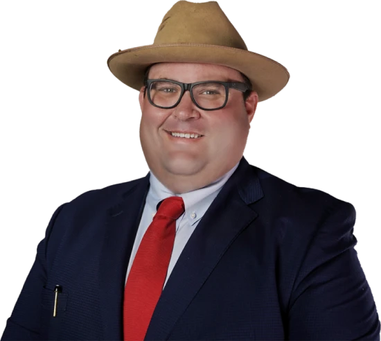 Man with hat in suit and red tie smiling