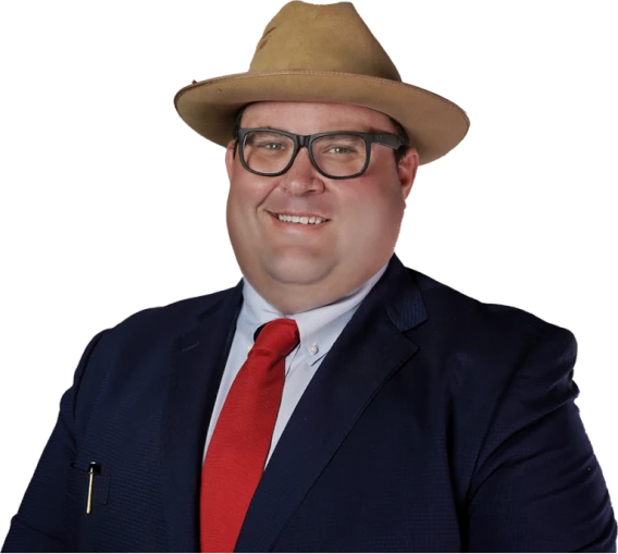 Man with hat in suit and red tie smiling