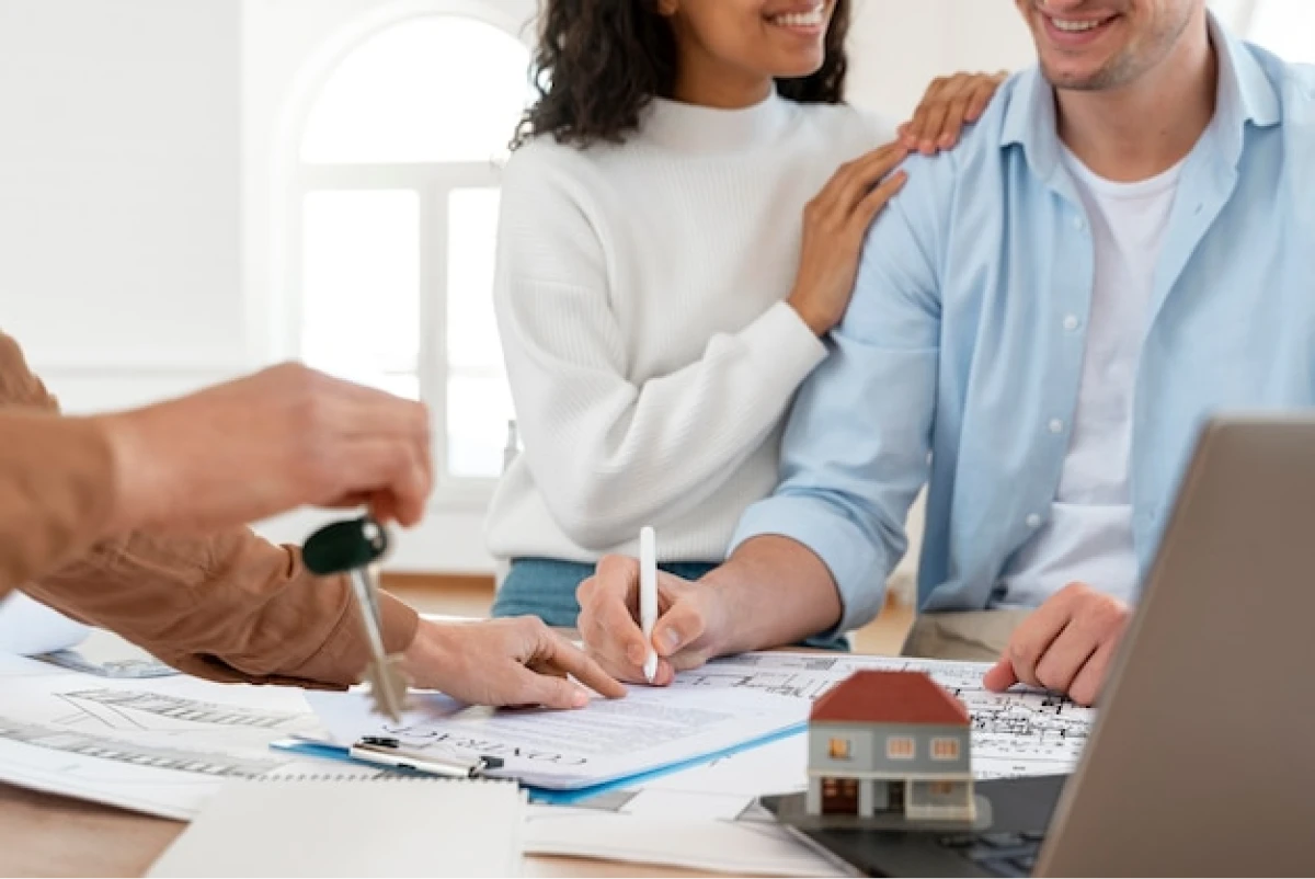 Couple signing real estate documents